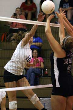 Alyssa Anderson (10) spikes one over the Mount St. Mary blockers. (Photo by Rick Nation)