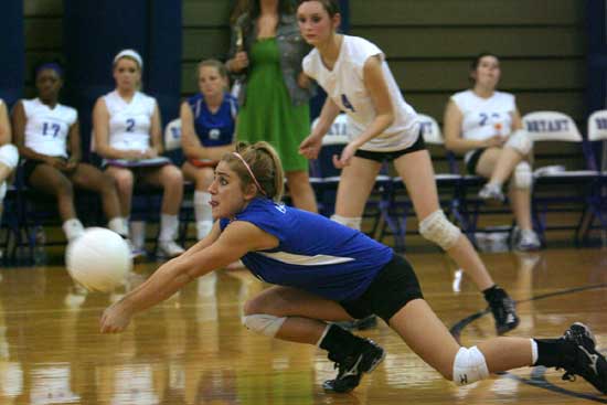 Caylin Choate digs up a hit. (Photo by Rick Nation)