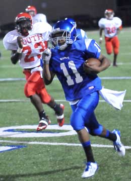 Mar'Kevius Nelson (11) runs past Cabot South's Brian Marshall on his way to the end zone. (Photo by Kevin Nagle)