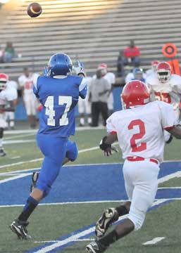 Bryant's Dillon Daniels (47) goes for a pass in front of a McClellan defender. (Photo by Kevin Nagle)