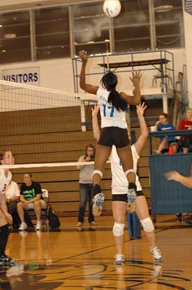 Brianna White (17) skies for a spike during Thursday's match with Cabot. (Photo by Valerie Nagle)