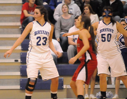 Bryant's Aubrey Allen (23) and Whitney Meyer (50) defend off the ball. (Photo by Kevin Nagle)