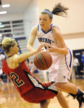 Logan Davis, right, and Russellville's Susan Taylor collide. (Photo by Kevin Nagle)
