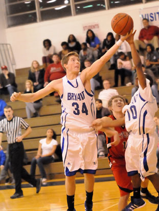 Bryant's Quinton Motto (34) and Anthony Black (10) vye for a rebound. (Photo by Kevin Nagle)