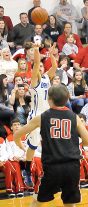 Brantley Cozart launches a 3-pointer over CAbot's Sam Howe (20). (Photo by Kevin Nagle)