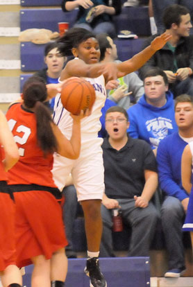 Dezerea Duckworth (5) tries to made a steal. (Photo by Kevin Nagle)