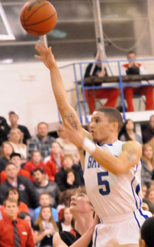 Jordan Griffin (5) shoots over the defense. (Photo by Kevin Nagle)