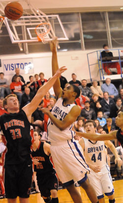 Jalen Hewett shoots over Cabot's Clayton Vaught (33) as Zach Cambron (44) gets in position. (Photo by Kevin Nagle)