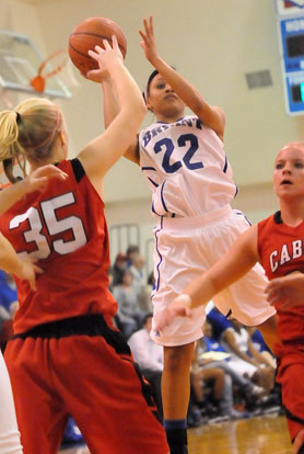 Kiara Moore (22) shoots over Cabot's Ally Van Enk (35). (Photo by Kevin Nagle)