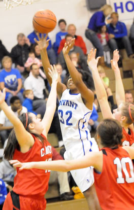 Taneasha Rhode (32) shoots in a crowd. (Photo by Kevin Nagle)