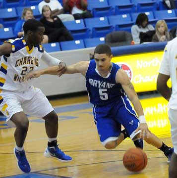 Jordan Griffin (5) drives on North Little Rock's Tyree's Hollister. (Photo by Kevin Nagle)