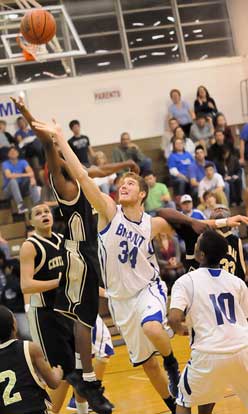 Bryant's Quinton Motto (34) shoots in a crowd. (Photo by Kevin Nagle)