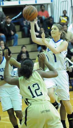 Bryant's Peyton Weaver puts up a shot over a Central defender. (Photo by Kevin Nagle)