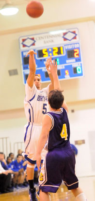 Jordan Griffin launches one of his four 3-pointers over Catholic's Carter Morse. (Photo by Kevin Nagle)