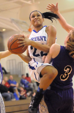 Kiara Moore goes up for a shot over Mount's Kaitlin Stuff (3). (Photo by Kevin Nagle)