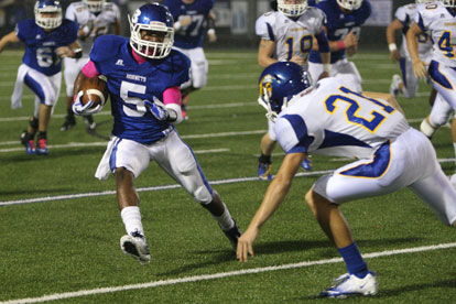 Bryant's K.J. Hill (5) looks to get past Sheridan's Kane Fitzgerald. (Photo by Rick Nation)