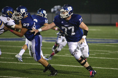 Ian Shuttleworth (77) and Dalton Griesmer (87) clear some running room. (Photo by Rick Nation)