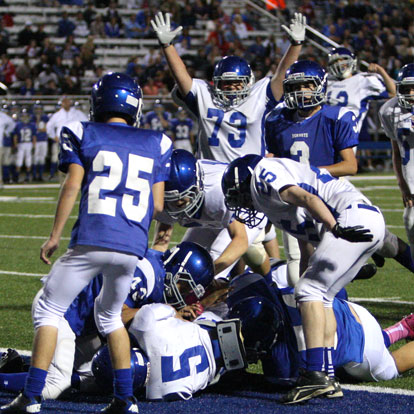 Noah Easterling (73) celebrates as teammate De'Amonte Terry (5) scores the go-ahead touchdown for Bryant White. (Photo by Rick Nation)