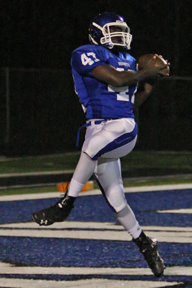 Demaja Price latches onto a touchdown pass just before the end of the half. (Photo by Rick Nation)