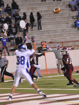 Nate Rutherford hauls in a pass for his first varsity touchdown. (Photo by Kevin Nagle)
