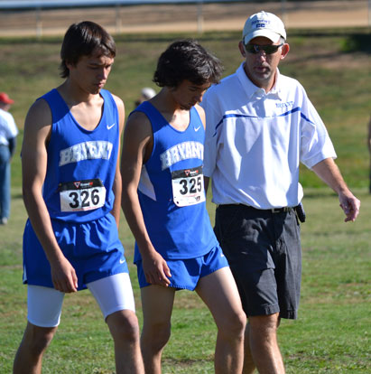 Bryant coach Steve Oury talks with Conner Wilson and Dru Wen.