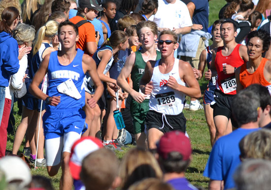 Bryant's Tyler Purtle approaches the finish line with rivals at his heels.