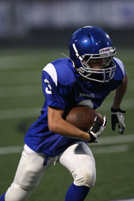 Sam Harrison heads upfield after catching a pass. (Photo by Rick Nation)