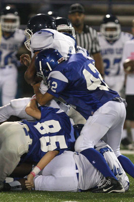 Bryant's Dillon Medlock (42) and Boston Heil (85) put the stops on a Conway running back. (Photo by Rick Nation)