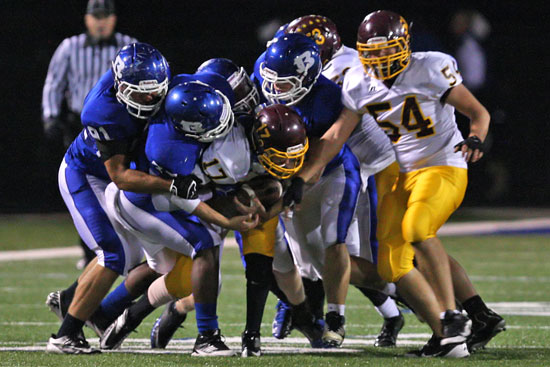 Lake Hamilton's Nathan Sawrie (17) gets swarmed by the Bryant defense. (Photo by Rick Nation)