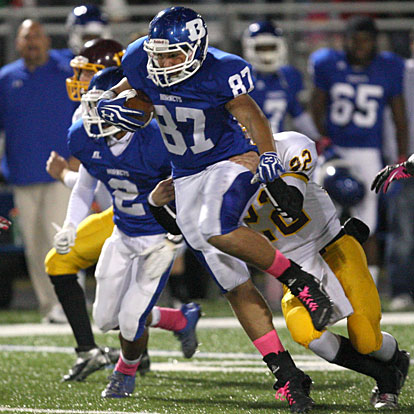 Junior tight end Dalton Griesmer (87) fights through a tackle attempt by Lake Hamilton's Stephen Shirley (22). (Photo by Rick Nation)