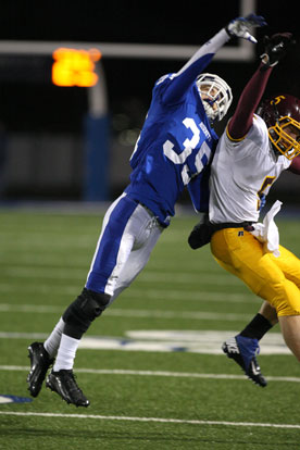 Bryant's Jake Johnson (35) knocks a pass away from Lake Hamilton's Levi Ringstorf. (Photo by Rick Nation)