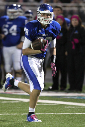 Tight end Nate Rutherford heads to the end zone after catching a pass midway through the second quarter. (Photo by Rick Nation)