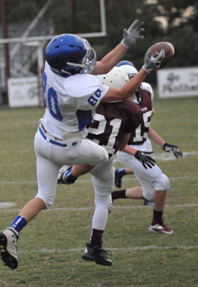 Bryant White's Garrett Misenheimer (80) can't quite hang on to a pass as Benton's Austin Bull (21) and Nate Beck (15) cover downfield. (Photo by Kevin Nagle)