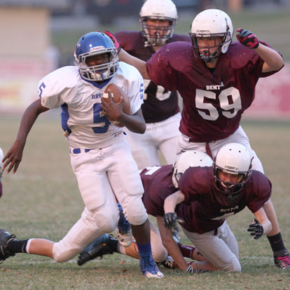 Bryant White's De'Amonte Terry (5) runs past a quartet of Benton defenders including Chandler Clift (52). (Photo by Rick Nation)