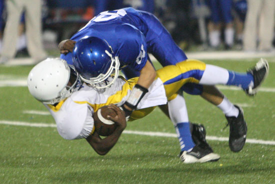 Jordan Gentry (81) plants North Little Rock's punt returner Carlton Burton, forcing a key fumble that set up Bryant's winning touchdown. (Photo by Rick Nation)