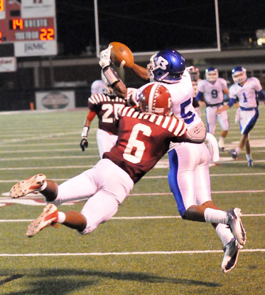 Bryant's K.J. Hill (5) fights Pine Bluff's Devarious Rice for a pass near the goal line. (Photo by Kevin Nagle)