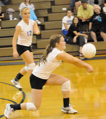 Abby Staton digs up a hit in front of teammate McKenzie Rice (12). (Photo by Kevin Nagle)