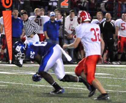 Kordell Boykins (65) scoops up a fumble in front of Cabot's Chris Henry. (Photo by Kevin Nagle)