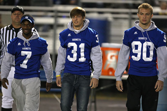 Injured senior Aaron Bell, Stoney Stevens and Justin Hollingshead were the captains for Bryant Friday night. (Photo by Rick Nation)