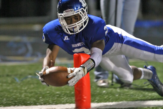 Bryant's Brushawn Hunter stretches the football across the goal line inside the pylon but was denied a touchdown on this play late in Friday's game against Cabot. (Photo by Rick Nation)