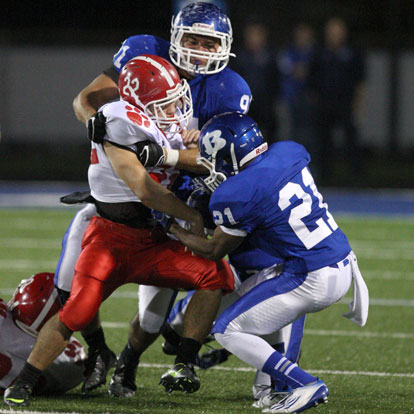 No fumble: Mark Nelson (21) appears to pull the football away from Cabot's Zach Launius as Tim Kelly (91) holds him up. (Photo by Rick Nation)