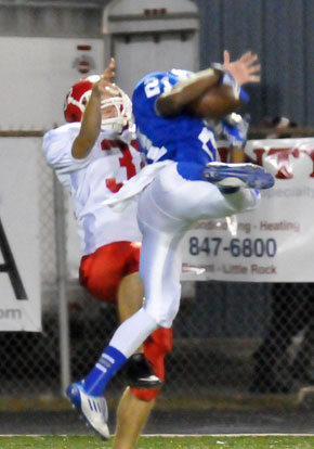 Mark Nelson makes a flying interception in front of Cabot's Chris Henry. (Photo by Kevin Nagle)