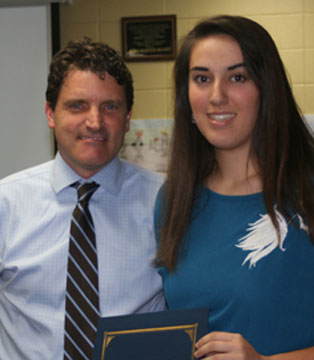 AP Scholar Whitney Meyer with School Board president Scott Hart.