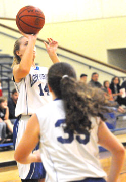 Riley Hill (14) triggers a shot. (Photo by Kevin Nagle)