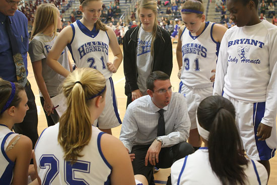 Bryant freshman girls coach Nathan Castaldi instructs during a break in the action Monday night. (Photo by Rick Nation)