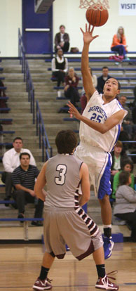 Bryant's Jaelyn Jones (25) launches a running jumper. (Photo by Rick Nation)