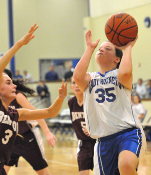 Reagan McCormick finishes off a drive. (Photo by Kevin Nagle)