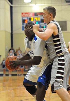 Bryant's Cameron Murray works against Benton's Westin Riddick. (Photo by Kevin Nagle))