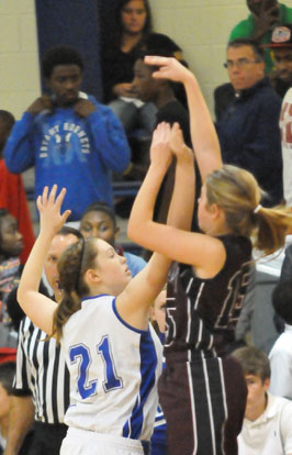 Bryant's Annie Patton (21) defends against Abby Clay's shot. (Photo by Kevin Nagle)
