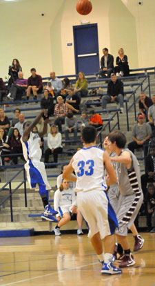 Simeon Watson launches a 3-pointer. (Photo by Kevin Nagle)